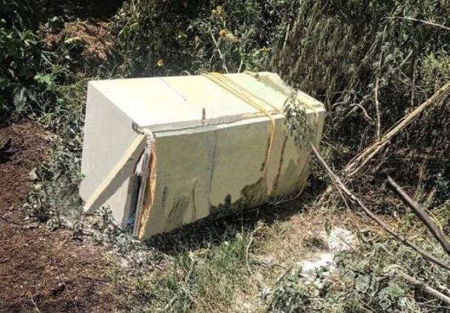 Encuentran refrigerador con un decapitado en Puebla